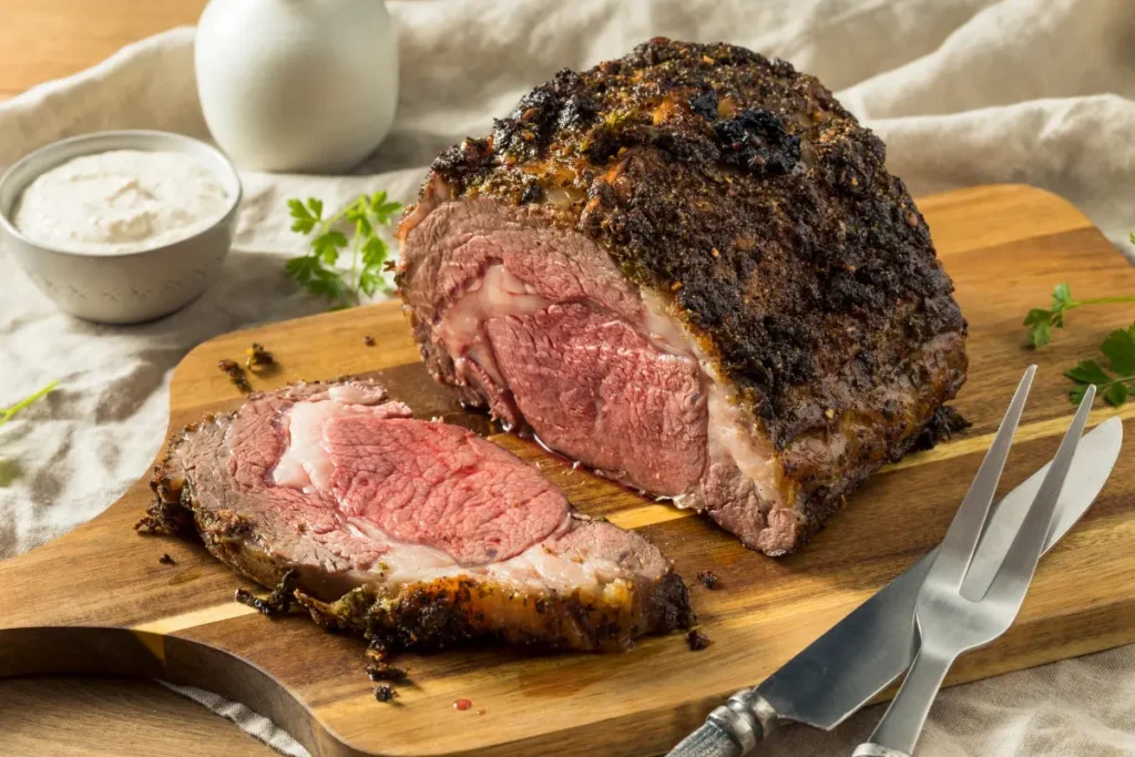 Perfectly cooked ribeye roast, sliced and ready to serve.
